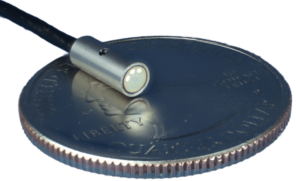 MHzPressure sensor in its miniaturized package on a quarter