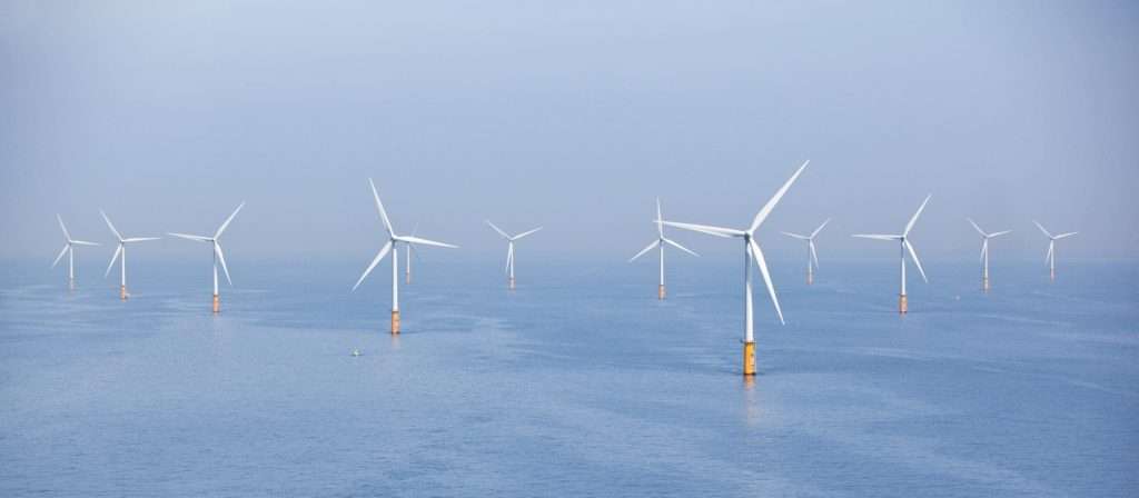 Several wind turbines in water